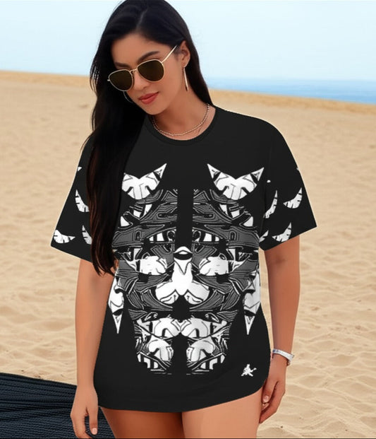Woman wearing a black t-shirt with white graphic design on a beach